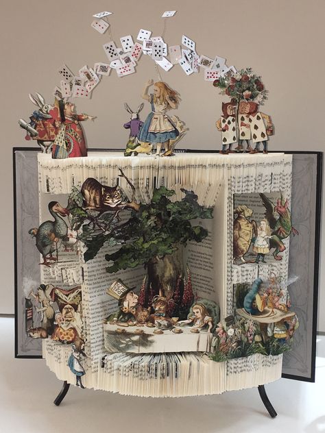 Book Diorama, Alice In Wonderland Crafts, Book Art Sculptures, Old Book Crafts, Bookshelf Art, Alice In Wonderland Book, Book Page Crafts, Altered Book Art, Folded Book Art