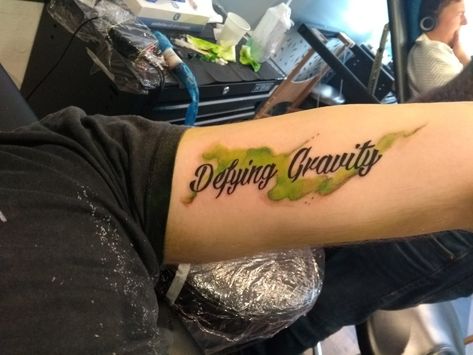 Defying Gravity tattoo Defy Gravity Tattoo, Defying Gravity Tattoo, Wicked Tattoo Designs, Gravity Tattoo, Wicked Tattoos, Defying Gravity, Mom Tattoos, Future Tattoos, New Tattoos