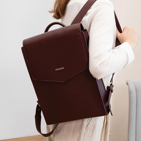 Practical stylish business backpack, which will be a great addition to a modern business look. Perfect straight lines in tandem with dark blue color make the backpack a benchmark of high taste. This backpack is perfect for business and casual style.The backpack is made of high quality genuine leather. Inside one spacious office and two pockets for trifles. The bag closes with magnetic buttons. Backpack straps are easily adjustable. Dimensions: 13.4x9.4x2.8 inches. Leather Backpack For School, Classy Backpack, Leather Backpacks For Women, Office Backpack, Elegant Backpacks, Spacious Office, Womens Work Bag, Soft Leather Backpack, Leather Backpack For Men