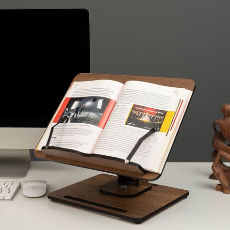 📚❤️Versatile and Convenient: Our Book Stand is the perfect addition to your collection of kitchen accessories and desk gadgets! It serves as a cookbook stand 📖, recipe book holder 📚, music score holder 🎶, or even as a wooden laptop stand 💻. The adjustable height and angle make it perfect for use in the kitchen 🍴, on your desk 📝, or even while reading in bed 🛏️! 🌟💪High-Quality Materials: Our Book Stand is made of high-quality engineered wood, ensuring durability and longevity 🌳👍. The Book Stand Design, Office Desk Setup, Wood Book Stand, Wooden Ipad Stand, Recipe Book Holders, Book Display Stand, Wooden Laptop Stand, Desk Gadgets, Book Rest