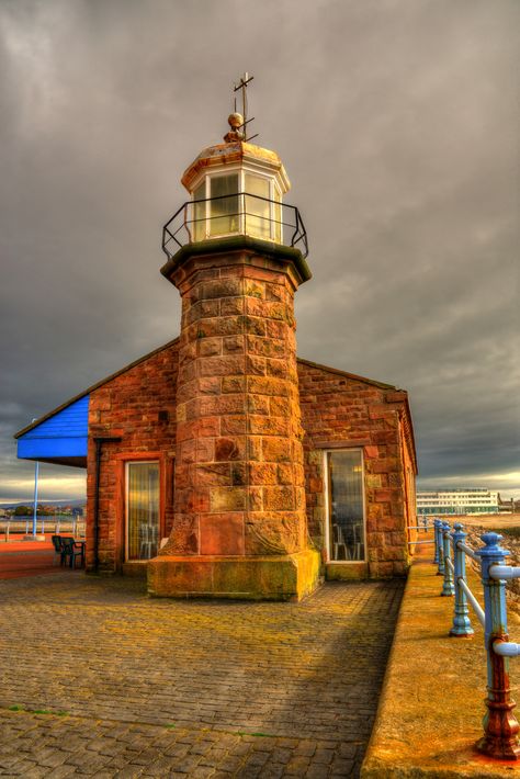 The Stone Pier Lighthouse at Morecambe, Lancashire, England was built in 1855. The octagonal stone tower with lantern and gallery is 26 feet tall. The lighthouse formerly guided railroad ferries sailing between Morecambe, England and Ireland. It is operated by the Lancaster Port Commission. Lighthouse Inspiration, Lancashire England, Sea Storm, Stone Tower, Lighthouse Photos, Lighthouse Pictures, All That Remains, Beautiful Lighthouse, Light Houses