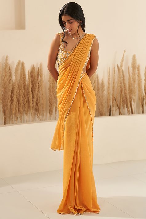 Featuring a mustard-draped saree in metallic georgette base with scalloped embroidered border. It is paired with a matching blouse having aari hand embroidery. . #perniaspopupshop #whatiworewastrending #ppuslove Yellow Saree Look Traditional, Plain Yellow Saree For Haldi, Freshers Dress, Plain Yellow Saree, Haldi Inspiration, Simple Half Saree, Pithi Outfit, Yellow Saree Look, Yellow Saree For Haldi