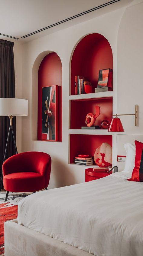 Discover the perfect blend of modern luxury and coziness in this stunning bedroom! The crisp white bed and walls create a peaceful environment, while rich red accents—a stylish chair, elegant lamp, and tasteful decorative items—inject warmth and personality. Soft, inviting lighting enhances the ambiance, making this space feel like a high-end retreat. #homedecor #homedesign #bedroomredo #bedroomdecor #bedroomdecorinspo Red Bedroom Ideas For Women, White And Red Bedroom, Red Accent Bedroom, Red And White Bedroom, Red Bedroom Walls, Red Bedroom Ideas, Red Interior Design, Red Bedroom Decor, Ny Apartment