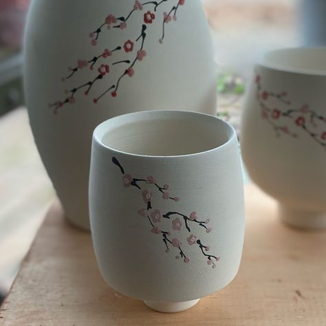 Cherry blossom yunomi . . . . #cherryblossom #porcelain #ceramics #handpainted #ceramicsofinstagram #wheelthrownceramics Cherry Blossom Mug Painting, Ceramic Glass Design, Painting Ideas On Clay, Pottery Painting Japanese, Japanese Pottery Painting, Painting On Ceramics Ideas, Cherry Blossom Pottery, Painted Mug Ideas, Paint Cherry Blossom