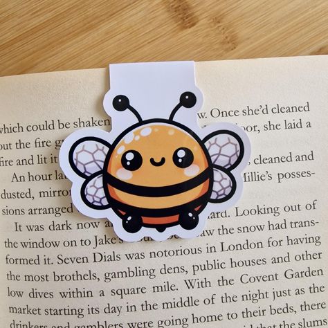 Bee Magnetic Bookmark | To Bee Continued | Cute Reading Pun | Page Saver | Handmade | Kawaii Bumble Bee Stationery | Buzzy Bee Collection by PapertreeStationary on Etsy To Bee Continued, Buzzy Bee, Rainbow Holographic, More Adventures, Magnetic Bookmarks, Bookmarks Handmade, Bee Happy, Glossy Paper, Book Accessories