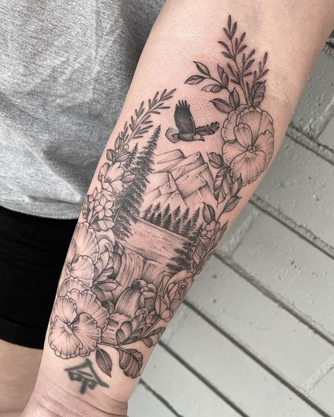 34 Magnificent Mountain Tattoo Ideas for Men & Women in 2024 Linework Forearm Tattoo, Landscape Tattoos For Women, Landscape Tattoo Women, Mountain Floral Tattoo, Naturescape Tattoo, Flower Mountain Tattoo, Women Tattoo Ideas Meaningful, Mountain Thigh Tattoo, Mountain Sleeve Tattoo Women