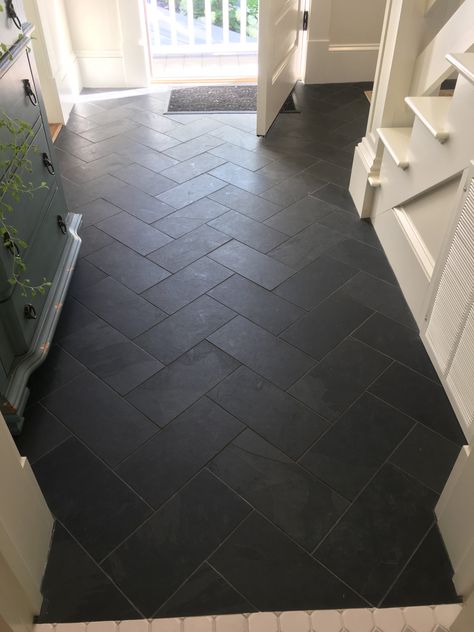 Herringbone Tile Entry, Black Hexagon Tile Mudroom, Mudroom Entryway Flooring, Gray Hexagon Tile Floor Mudroom, Dark Tiled Kitchen Floors, Black Floor Tile Laundry Room, Black Mudroom Tile, Black Herringbone Tile Floor Entryway, Laundry Room With Black Tile Floor