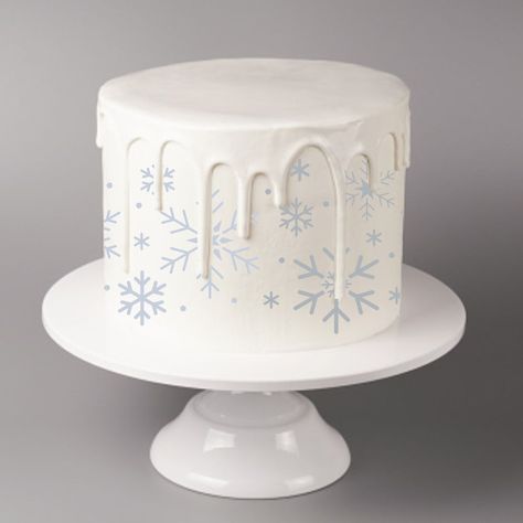 This wintry cake stencil features falling snowflakes that will make any holiday cake extra special. Our stencils can be used with royal icing, airbrushing and any other confectionery medium. Works beautifully with our Snowflake Cake Stencil Top Trio. Sizing (sheet sizing includes thumb-holds): Sheet Size: 4.5" h x 8" w / Design: 3.5" h x 5"w Sheet Size: 4.5" h x 16" w / Design: 3.7" h x 12.7"w Custom Cake Stencils: Contact us today or start a chat conversation with us if you need this in a diffe Snowflake Cake Ideas, Snowflake Cake Birthday, Winter Birthday Cakes, Winter Onederland Smash Cake, Winter Onederland Cake Smash, Snowflake Birthday Cake, Winter Themed Cake, Winter Birthday Cake, Snowflakes Cake