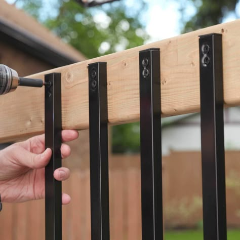 These surface-mounted, rectangular balusters are perfect for enhancing decks, porches, gazebos, and more. It's an easy way to accent your outdoor project while simultaneously adding beauty, strength, and safety. Not only are they versatile for many types of projects, but they also complement and install easily on composite, vinyl, wood, and more. Whether you're a busy contractor or a DIYer looking for an easy backyard upgrade, these balusters will be perfect for you. Ultimately, their strong, galvanized steel construction will not only outlast the competitor's leading aluminum baluster but also transform your environment. Nuvo Iron 1/2-in x 1-in x 38-in Black Powder Coated Galvanized Steel Rectangular Deck Baluster | RCTB38-ESP Railing For Decks Simple, Metal Rails For Front Porch, Outdoor Patio Railing Ideas, Cheapest Deck Railing, Affordable Deck Railing Ideas, Cheap Porch Railing Ideas, Railing Alternatives, Easy Deck Railing Ideas, Stair Railing Ideas Outdoor