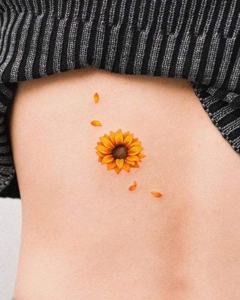 zihong | Sunflower petals around a mole🌻 💛contact : E-mail or Proflie link 📩zihongtattoo@gmail.com ✨예약문의 : 프로필링크 or 메일 | Instagram Sunflower Seed Tattoo, Tattoo Around Mole, Cute Sunflower Tattoo, Dog Paw Sunflower Tattoo, Sunflower Neck Tattoo, Small Sunflower Tattoo Simple, Tiny Tattoos Sunflower, Sunflower Cluster Tattoo, Sunflower Temporary Tattoo