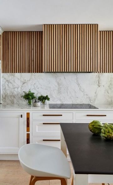 Fresh Kitchen Inspo Modern Fluted Kitchen Cabinets, Wood Slat Range Hood, Slatted Kitchen Island, Wood Slat Backsplash Kitchen, Slat Backsplash, Wood Slat Kitchen, Kitchen Hood Ideas Modern, Kitchen Range Hood Ideas, Modern Kitchen Hood