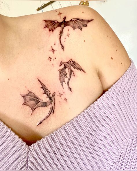 #CoolTattoos #TattooArt #InkMaster #TattooDesigns #InkedUp #TattooLovers #InkInspiration #TattooIdeas #CreativeInk #TattooStyle Magical Dragon Tattoo, Got Dragon Tattoo Daenerys Targaryen, Feyre Acheron Tattoo, Tiny Dragons Tattoo, The Thirteen Tattoo Tog, Dragon Feminine Tattoo, Throne Of Glass Wyvern Tattoo, The Fourth Wing Tattoo, Rock Inspired Tattoos