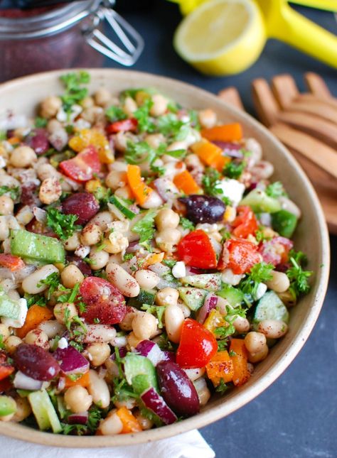 Mediterranean Bean Salad packs chickpeas, white beans, your favorite Mediterranean vegetables and feta cheese into one healthy salad and is topped with a light lemony dressing. This works perfectly as a side dish to a meal or even as lunch with pita bread and hummus. // acedarspoon.com #beansalad #salad Pita Bread And Hummus, Mediterranean Bean Salad, Salads Summer, Lemony Dressing, Pane Pita, Mediterranean Vegetables, Mediterranean Chickpea, Pita Wrap, Bean Salad Recipe