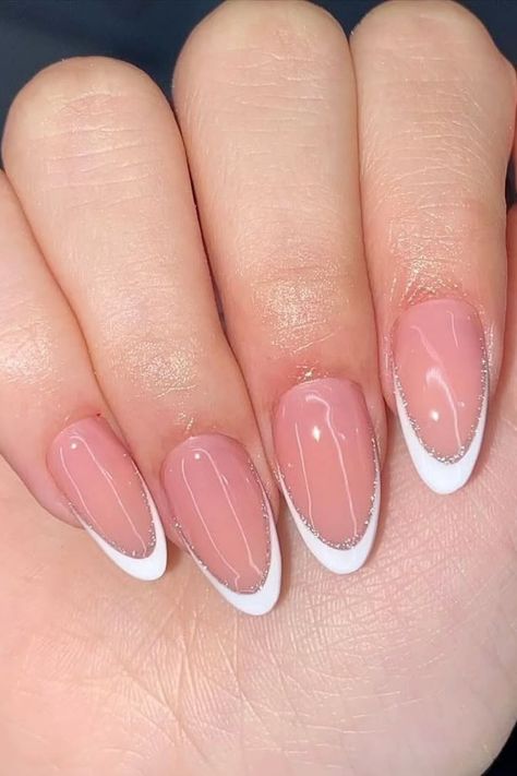 A beautifully manicured hand showcasing a classic French tip design with a modern twist. The nails are a soft pink, tipped with a crisp white line and a delicate line of glitter for added sparkle.  #nailsdesign #nails #nailsofinstagram #nailart #nailsart #nailsoftheday #nailsnailsnails #nailstagram #manicure Ballerina Nails Designs, Uñas Ideas, Manicure Tips, Fake Nails With Glue, Ballerina Nails, Nails Set, Easy Nails, Nail Supplies, Stick On Nails