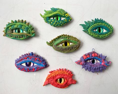 Air Dry Clay Projects For Middle School, Medieval Clay Projects, Dragon Eyes Art Lesson, Modeling Clay Art Projects, Dragon Art Elementary, Polymer Clay Dragon Eye, Dragon Eyes Clay, Dragon Eye Clay Art, Dragon Eye Craft