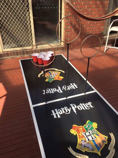 This game is definitely going to be the most liked activity by your guests. The rules remain the same as that of the beer pong. To make the game more Harry Potter-ish, make three rings on three stands as shown below and place them between the two cup-sets and the person should goal by passing the ball through the stands. Harry Potter Beer Pong, Harry Potter Themed Birthday Party, Harry Potter Graduation, Harry Potter Themed Birthday, Harry Potter Themed Party, Harry Potter Christmas Decorations, Harry Potter Props, Harry Potter Theme Birthday, Themed Party Ideas