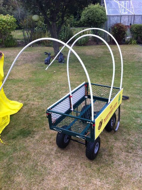 This Instructable turns a plain gardening cart into a kids' Covered Wagon. As well as for cowgirl/boy play, this comes in handy at festivals for transporting sleepy kids. Diy Chuck Wagon Table, How To Make A Covered Wagon, Festival Trolley Ideas, Diy Covered Wagon Table, Wagon Canopy Diy, Diy Wagon Cart, Diy Wagon Canopy, Pvc Wagon, Diy Covered Wagon