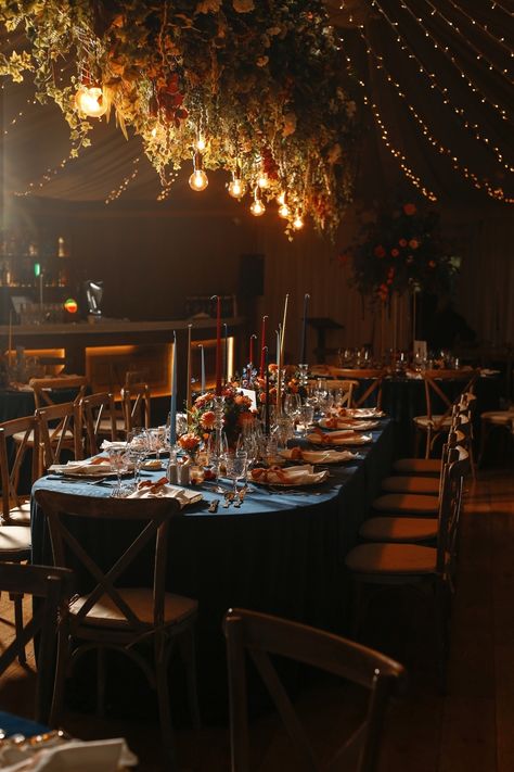 Claire and Kevin envisioned a dinner party atmosphere for their reception, with navy velvet linens, hand-painted velvet ribbon place cards, and overflowing florals and fruits as centerpieces. Danish candles added a soft glow, creating the perfect ambiance. Planner: @tarafayevents Florals: @flowersbymoira Photography: @brettharkness Stationary & Invitations: @grosvenorstationerycompany Linens: @totalevent.ie Monogram: @sarahodea Venue: @Virginia_park_lodge . . . . . #Tarafayevents #tarafay #... Jewel Tone Tablescape, Moody Dinner Party, Ribbon Place Cards, Moody Tablescape, Painted Velvet, Midnight Garden, Long Holiday, Holiday Dining, Navy Velvet