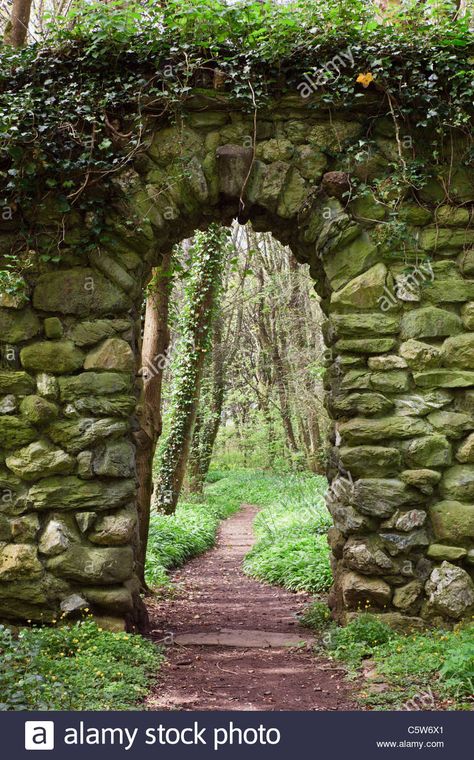 Download this stock image: Stone wall arch over a garden path leading into woodland. UK - C5W6X1 from Alamy's library of millions of high resolution stock photos, illustrations and vectors. Owencore Aesthetic, Anglesey Wales, Wall Arch, Stone Walls Garden, Stone Archway, Lost Garden, Outdoor Stone, Dry Stone Wall, Garden Arches