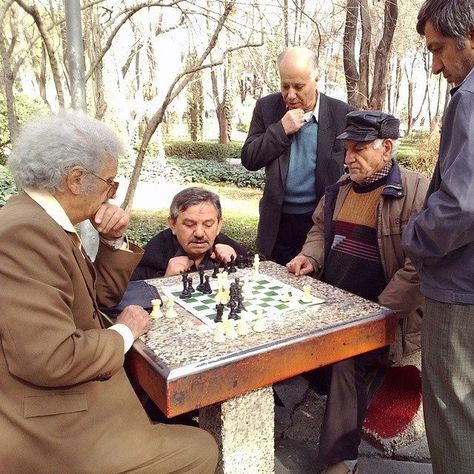 Elderly men playing chess in Hasht-Behesht Park. #Isfahan, #Iran. Photo by Reyhaneh Ehsanpour @reyhanoo Outdoor Chess, Neighborhood Park, Persian People, Isfahan Iran, Park Games, How To Play Chess, Playing Chess, Elderly People, Public Park