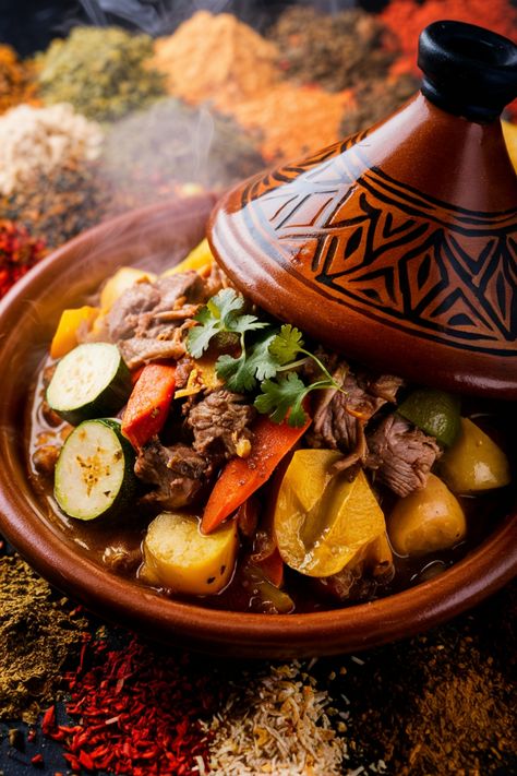 Moroccan lamb tagine with vegetables and herbs in a traditional clay pot. Moroccan Food Traditional, Traditional African Food, Morocco Recipes, Africa Dishes, Moroccan Tagine Recipes, Moroccan Tajine, Moroccan Tagine, Morocco Food, Moussaka Recipe