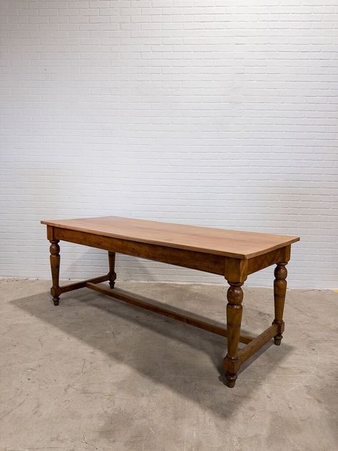 With beautifully turned legs and a newly restored surface, this antique table is ready for its new home.  Dimensions: L: 72"  W: 29.37"  H: 28.25"  Apron: 22.75" from floor Note- this table is lower than typical. Please make sure the floor to apron height will work for you prior to ordering. Please note: Signs of wear are considered proof of age. Scratches, chips, dents, cracks, signs of historical repair, replaced hardware and uneven coloring are all very common with antique furniture. We do our best to represent each piece well so there are no surprises upon arrival. If you have questions about an item or would like additional photos prior to purchasing, we will be happy to accommodate.  Shipping: To help keep shipping costs down, we bundle orders and ship to each region regularly. We sh Ukrainian Dishes, Antique Work Table, Butcher Table, Bakers Table, Traverse City Mi, L Shaped Kitchen, Kitchen Dining Tables, Antique Table, Traverse City