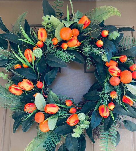 Hello summer! Add a fresh twist of vibrant orange to your front door or kitchen with this sweet orange and tulip wreath! This citrus wreath comes in 20, 24 and 28 inches. The 20 inch wreath is pictured. Double Door Wreath, Summertime Decor, Spring Front Door, Tropical Wreath, Double Door Wreaths, Summer Mesh Wreaths, Fruit Wreath, Orange Wreath, Green Witchcraft