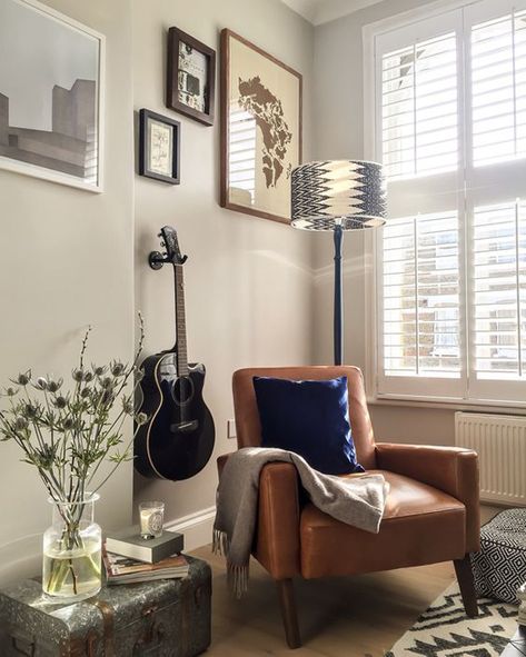 Guitar Corner Ideas, Music Setup Living Rooms, Guitar In Living Room Decoration, Guitar Stand Living Room, Vintage Music Room Decor, Guitar Nook Room Ideas, Music Corner Decor, Guitar As Decor, Corner Armchair Living Rooms