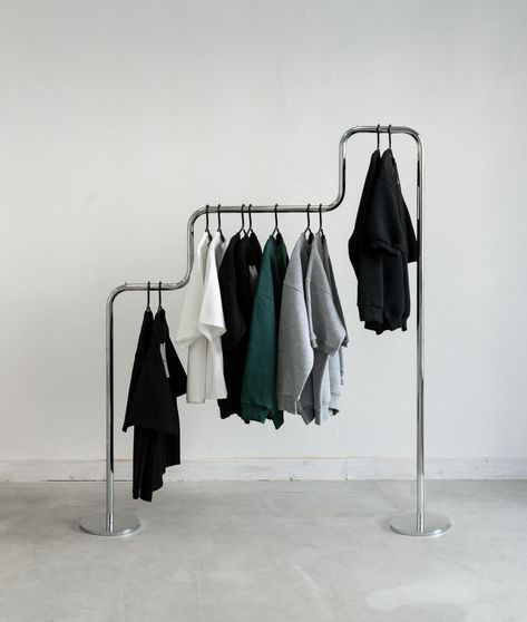 Steel Clothes Rack, Unique Clothing Rack, Showroom Design Fashion, Cool Clothing Rack, Diy Cloth Rack, Clothing Pop Up, Bauhaus Wardrobe, Clothing Rack Design, Clothes On A Rack