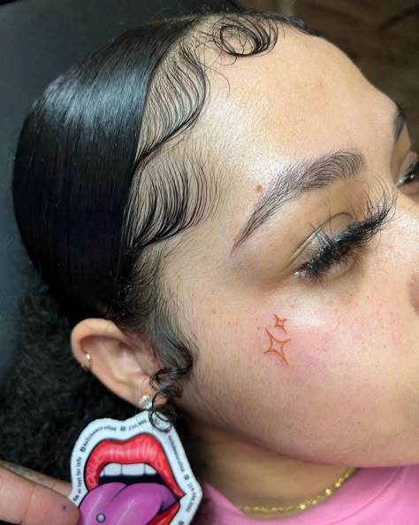 Side Cheek Tattoos, Red Ink Face Tattoo, Small Face Tats Black Women, Heart Face Tattoo Men, Small Female Face Tattoo, Stars Face Tattoo, Pink Face Tattoo, Red Face Tattoos For Women, Star Tattoo On Face