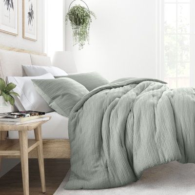 Indulge in the epitome of comfort with our exquisite 3 piece Waffle Textured Comforter set. Its polyester fill ensures a dreamy sleep experience, while the Soft Pre-Wash Finish and Double-Brushed fabric provide a luxurious touch. Plus, its oversized dimensions are perfect for extra deep mattresses. Elevate your sleep sanctuary today and embrace the ultimate in cozy sophistication. | Ebern Designs All Season Polyester Down Comforter Green 70.0 x 90.0 x 4.0 in | C110157398_1294907674_1294907684 | Seafoam Green Bedding, Green Bedding Master Bed, Light Gray Comforter Bedroom, Green Bedding Master, Sage Green Bed Sheets, Grey Comforter Bedroom, Guest Bedroom Ideas Cozy Modern, Cozy Coastal Bedroom, Sage Green Bedding