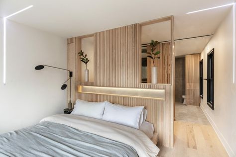 Room Divider Bedhead, Bed Middle Of Room Master Suite, Room Divider Ideas Bedroom Master Suite, Ensuite Behind Bed, Modern Owners Suite, Contemporary Master Suite, Walk In Closet Behind Bed Master Suite, Bed Middle Of Room, Bed In Middle Of Room Ideas