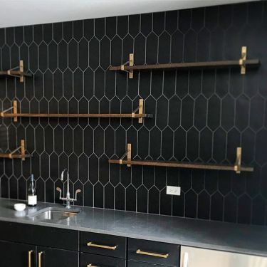 Tile Best Sellers | TileBar.com Black Backsplash, Home Bar Designs, Black Tiles, Hexagon Tiles, Basement Bar, Black Kitchen, Black Cabinets, Commercial Flooring, Black Kitchens