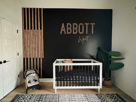 Black And Wood Crib Nursery, Black And Oak Nursery, Black Wall In Nursery, Black White Wood Nursery, Black Theme Nursery, Boy Nursery Ideas Black Crib, Dark Grey Accent Wall Nursery, Dark Earthy Nursery, Nursery Wood Slat Wall