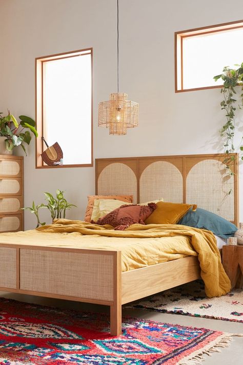 Looking to create a bohemian feel in your bedroom? One of the easiest ways to do so is with your bed. While there are many styles of boho beds, some o... | Go Retro with a Wood + Cane Bed Frame Tan Wood Bed Frame, Boho Bed Frame, Tall Bed Frame, Bedroom Pieces, Geometric Headboard, Rattan Bed, Beds And Headboards, Boho Bedding, Up House