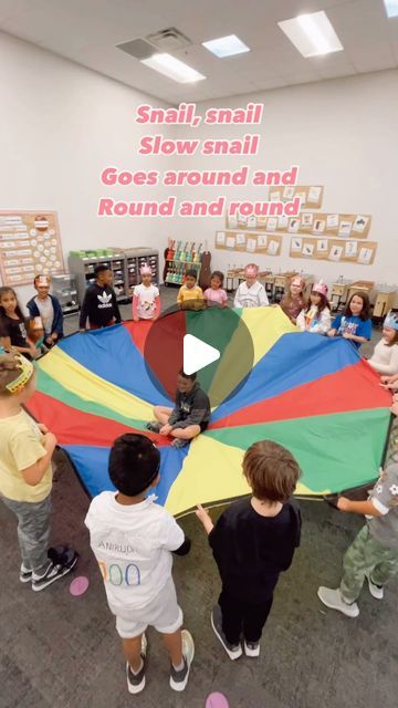 Hannah Zimmermann on Instagram: "Snail, Snail - parachute activity 🙌🏻 The kids love this so much that we usually do this in kinder and 1st, but here I even pulled it out for 2nd! I use this to either prep so and mi or prep la. It’s also great for quarter notes and eighth notes OR to have a discussion about tempo. As we learn this song, I like to have the students move around the room like a slow snail. Then I will ask them what other slow animals there are? We’ll act those out too, and before you know it - the kids are writing their own lyrics. Talk about getting your bang for your buck in a song 💰  #elementarymusiceducation #elementarymusic #elementarymusicteacher #elementarymusicrocks #iteachmusic #fisdfineartsleads #fisdelevate #musiced #musiceducation #musiceducationmatters #musicte Music And Movement For Preschoolers, Snail Activity For Preschool, Moving Activities For Preschoolers, Parachute Activities For Preschool, Snail Preschool Activities, Parachute Songs For Preschool, Creative Movement Activities For Kids, Parachute Games For Preschoolers, Snail Activities For Kids