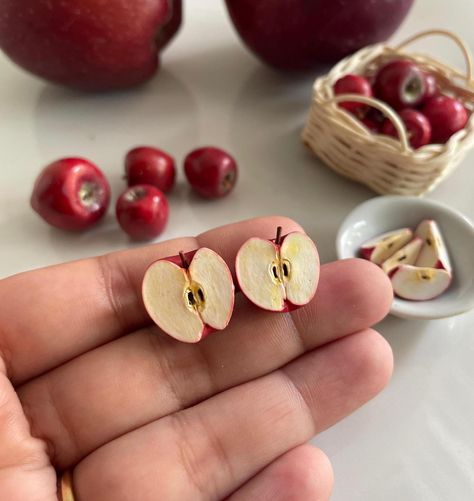 These Apple Studs are perfect for those who loves Apple ! This is a 100% hand-made realistic fake food miniature. Now you can have your favourite fruits as a Miniature earrings. "Hello Miniverse" creates uniquely handmade fruits inspired Fruits Earrings that look as delicious as the real thing.  I make sure packaging is high quality to sustain rough handling by courier service during transit. Dispatch time: Within 15 days.  Delivery time:  Domestic: 5-6 Days International: 20-25 days. Care: Please treat the Apple Studs with care. Remove dust with a piece of soft fabric, a brush or a sponge. Protect the product from damages. Do not drop. If you have any question about this listing or anything else, please feel free to contact me. I will get to you as soon as i can! Thanks for viewing this l Fruit Accessories, Miniature Earrings, Polymer Clay Accessories, Apple Bag, Clay Fruit, Apple Earrings, Clay Making, Quirky Jewelry, Fruit Jewelry