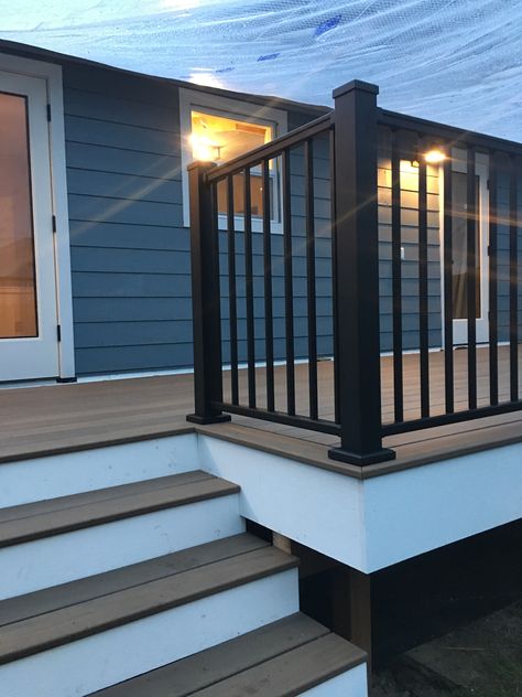 Our deck is coming along! #timbertech #pecan #boothbayblue Deck With Blue House, Dark Blue House With Deck, Deck Colors For Dark Blue House, Outdoor Deck Color Ideas, Blue House With Deck, Deck Colors For Blue House, Timbertech Deck Ideas, Grey Siding House, Navy Blue House Exterior