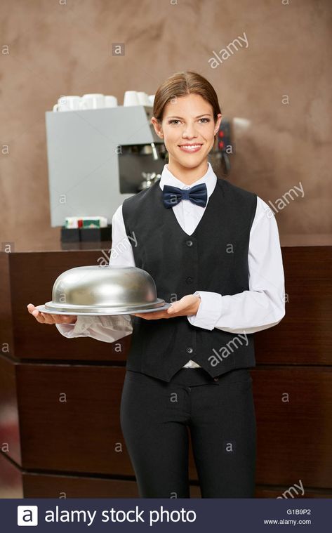 Female waiter in uniform with food under a cloche in a hotel restaurant Stock Photo Hotel Uniforms, Waitress Uniform, Hotel Uniform, Ideas Clothes, Hotel Restaurant, Business Ideas, Solar, Stock Images, Resolution