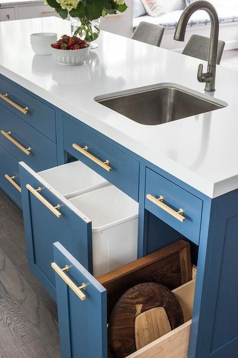 A curved stainless steel prep sink paired with a satin nickel gooseneck faucet is fixed to a white quartz countertop contrasting a Benjamin Moore Van Deusen Blue island adorned with Lewis Dolan brass pulls. Blue Kitchen Island, Kitchen Island With Sink, Unique Kitchen Design, Kitchen New York, Prep Sink, Space Saving Kitchen, Transitional Kitchen, Blue Kitchens, Unique Kitchen