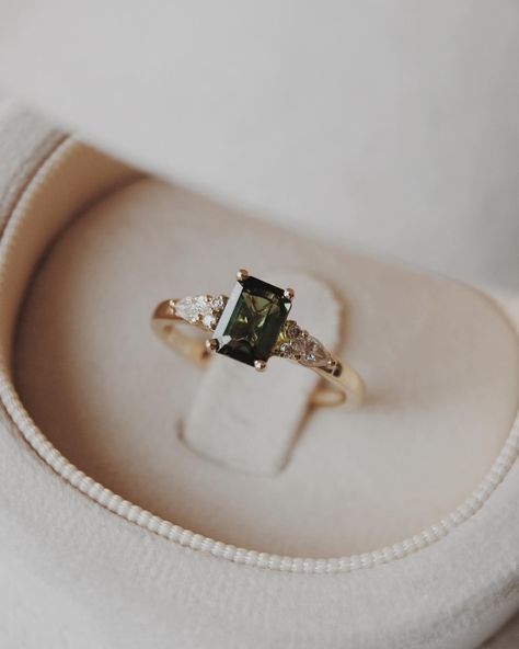 Congratulations Quin + Rae 🥹💍🍾 We customized our Elsie setting, switching out the centre stone for a stunning 6x4mm natural dark green tourmaline with pear and round accents. We wish you the best for your engagement season!! Engagement photos by the lovely: @jordanfayephotography Dark Green Engagement Ring, Olive Branch Jewelry, Green Wedding Ring, Green Wedding Rings, Old New Borrowed Blue, Green Engagement Rings, Engagement Season, Beautiful Baubles, Ring Inspo