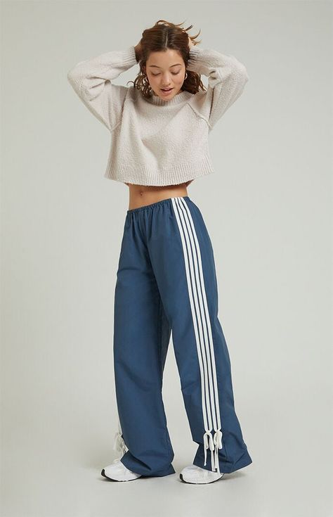 Step into athleisure vibes with the PacSun Wide Leg Track Pants. These trendy track pants combine comfort and style with a wide-leg silhouette, stripes down the leg, and ties at the ankles, offering a versatile and laid-back addition to your wardrobe, perfect for casual outings or cozy days at home.11.5" rise31.5" inseam23" leg openingHigh-riseElastic waistbandStripes down the legsTie detail at the ankleSide hand pocketsWide leg openingRelaxed fitRoomy through the hip and thigh62% cotton, 38% nylon; Mesh lined pockets: 100% polyesterMachine washableModel is wearing a size smallModel measurements: 5’6.5” height, 32” bust, 23” waist, 35” hipsMeasurements taken from a size small PacSun Womens Navy Wide Leg Track Pants - Blue size Small Wide Leg Track Pants, Pants Blue, Navy Women, Pacsun, Track Pants, Athleisure, Casual Pants, Wide Leg, At Home