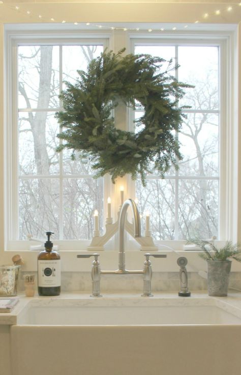 Swedish candles at window over farm sink with Christmas wreath and fairy lights - Hello Lovely Studio Scandi Christmas Decorations, Holiday Interior, Frasier Fir, Scandinavian Christmas Decorations, Kitchen Diy Makeover, Scandi Christmas, Romantic Christmas, Christmas Decor Inspiration, Swedish Christmas