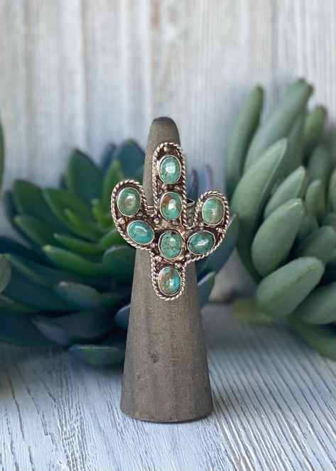 Crafted with genuine turquoise, our cactus ring boasts the perfect size to make a statement without being too big. Its adjustable design guarantees a comfortable fit for any finger. Elevate your style with this unique accessory. Cactus 1.5”x2” Nfr Outfits, Cactus Ring, Navajo Pearls, Southwest Jewelry, Cowgirl Western, Genuine Turquoise, Retail Therapy, Christmas Wishlist, You Call