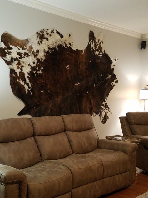 Hang Cowhide On Wall, Animal Hide Wall Hanging, Cow Hide On The Wall, Cowhide On Wall Ideas Living Room, Cowhide Rug On Wall Ideas, Hanging Cowhide On Wall, How To Hang A Cowhide On The Wall, Cow Hide Rug On Wall, Cow Hide On Wall Decor