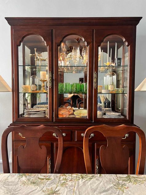 Dishes and glassware in wood china cabinet. Glass China Cabinet Display, Contemporary China Cabinet Display, Organizing China Cabinet Display, How To Style China Cabinet, China Cabinet Living Room, Dining Room With China Cabinet, Crystal Glassware Display, Curved Glass China Cabinet, China Hutch Display