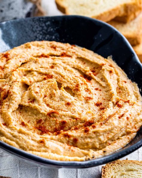 This Red Lentil Hummus has everything you love about traditional hummus, but made with red lentils that boast a sweet and nutty flavor. #redlentils #lentils #hummus #recipe Lentil Hummus Recipe, Lentil Hummus, Red Lentil Recipes, Hummus Recipe Homemade, Pepper Hummus, Garlic Hummus, Roasted Red Pepper Hummus, Red Pepper Hummus, Red Lentils