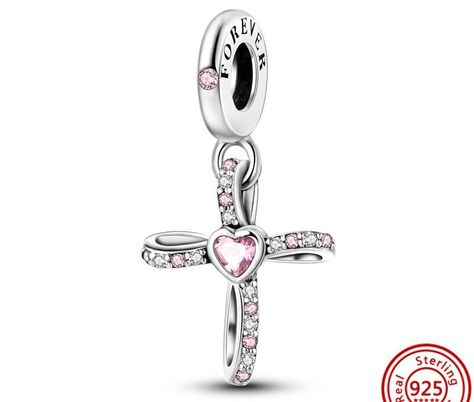 Jesus Cross Sterling Silver and Pink Zirconia Charm for Pandora Bracelets: Add a touch of faith and beauty to your Pandora bracelet with this stunning Jesus Cross charm. Made from high-quality 925 sterling silver and adorned with sparkling pink zirconia stones, this charm is the perfect addition to any jewelry collection. Made from genuine 925 sterling silver, ensuring durability and longevity. Adorned with beautiful pink zirconia stones that catch the light and sparkle from every angle. Fits Pandora bracelets, making it easy to add to your existing collection or start a new one. Features a stunning Jesus Cross design, showcasing your faith and devotion. Adds a touch of beauty and elegance to any outfit. Makes the perfect gift for any occasion, from birthdays to religious holidays. Serves Pink Charm, Bracelet Pandora, Silver Wings, Silver Crown, Pendent Necklace, Jewelry Making Charms, Silver Accessories, Sterling Silver Cross, Diy Schmuck