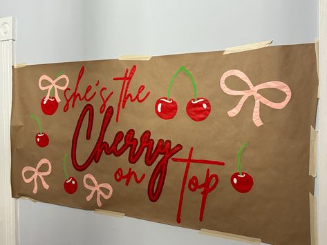 Add a sweet touch to your celebration with our "She's the Cherry on Top" hand-painted banner! This eye-catching design features vibrant red cherries and playful pink bows, making it the perfect statement piece for birthdays, bachelorette parties, or any special event.  Each banner is hand-painted with care on high-quality Kraft paper, ensuring a unique and personal touch to your decor. Choose from two sizes: 30" x 64"  24" x 51" Want to make it even more special? Our banners are fully customizable! Change the colors, add a name, or modify the message to make it your own. **Why You'll Love It - **Hand-Painted Each banner is individually painted by hand, making every piece one-of-a-kind. - **Customizable Personalize your banner to match your event's theme and vibe. - **Versatile Perfect for Shes The Cherry On Top, 27th Birthday Themes For Women, Sorority Sheet Signs, She’s A Cherry On Top, Our Little Cherry On Top, Banner Painting Ideas, Brown Paper Painted Banner, Birthday Banners Painted, Cherry Bachelorette Party