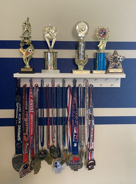 Sports Trophy Display Ideas, Football Medal Display Ideas, Displaying Medals Ideas, Ribbon And Trophy Display Ideas, Medals And Trophy Display Ideas, Soccer Trophy Display Ideas, Sports Metal Display Ideas, Trophies Display Ideas, Sports Display Wall